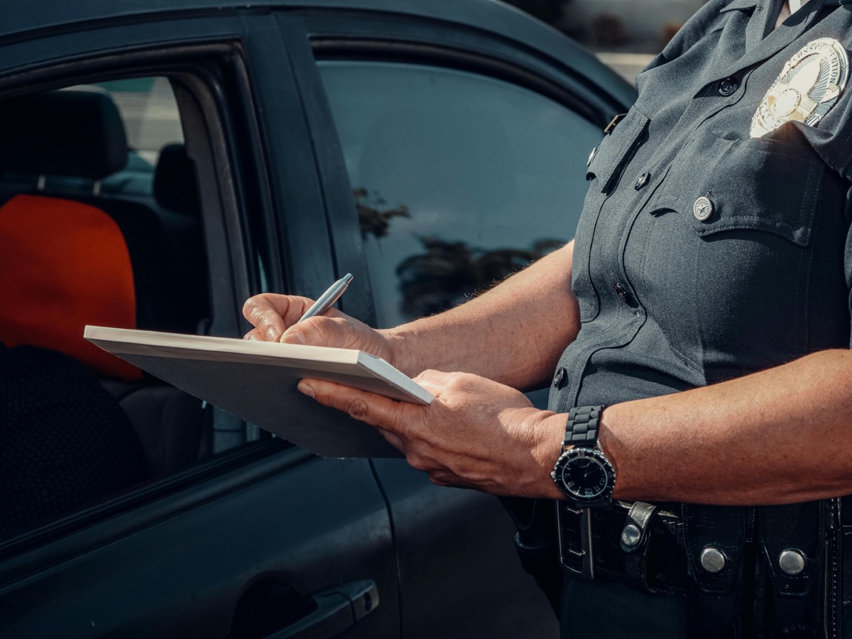 Police officer at car window during a traffic stop in Florida